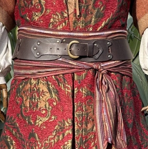 Crimson sash tied under a brown buffalo leather belt, belt sold separately
