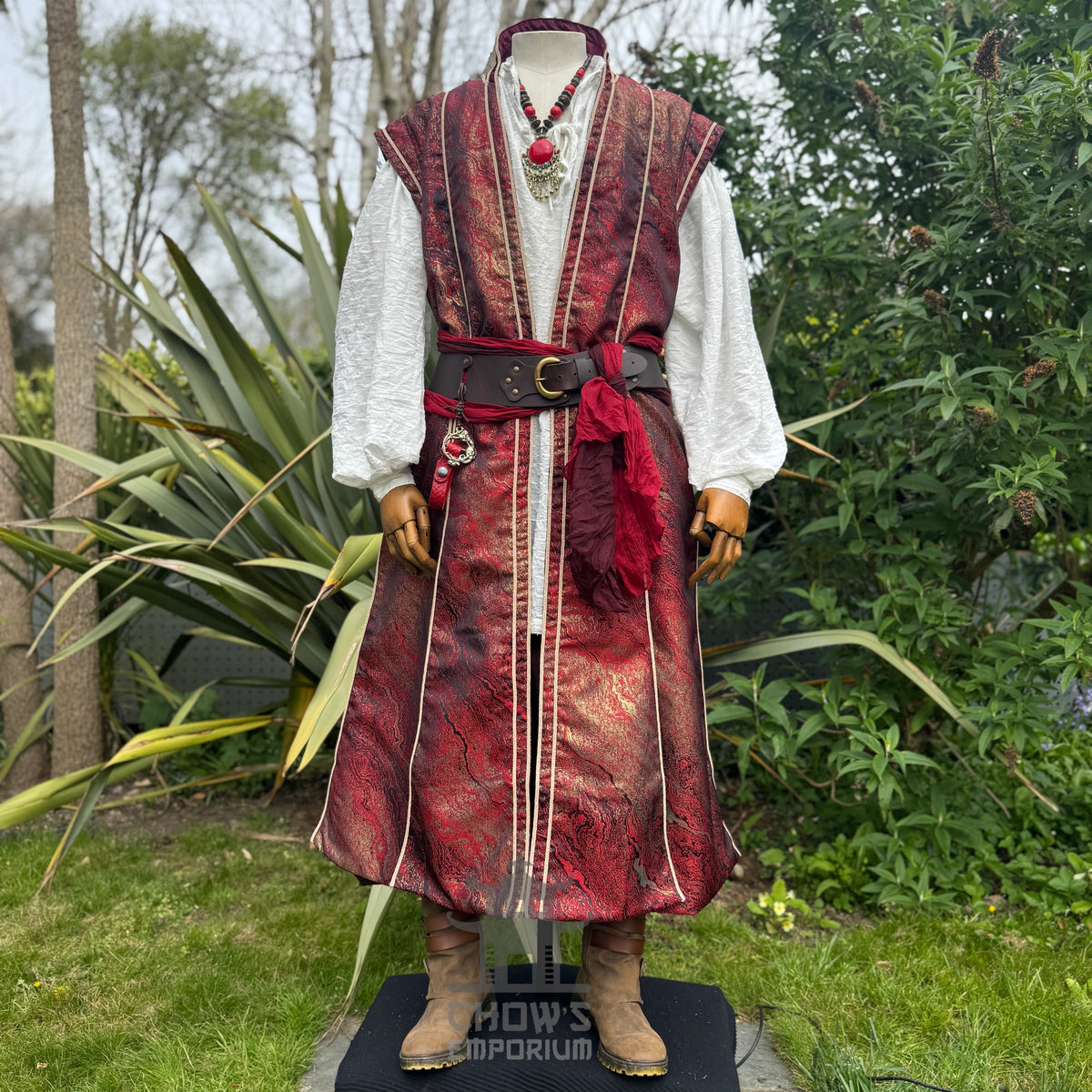 Crimson and gold LARP waistcoat worn over a white shirt with sash, belt and necklace
