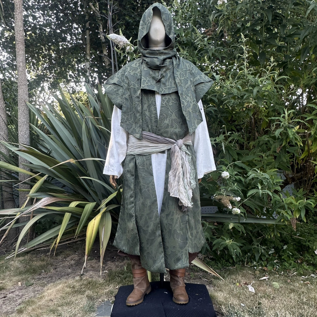 Green panelled waistcoat with the hood collar stood at the neck and a sash at the waist, front view. Shirt and sash sold separately.