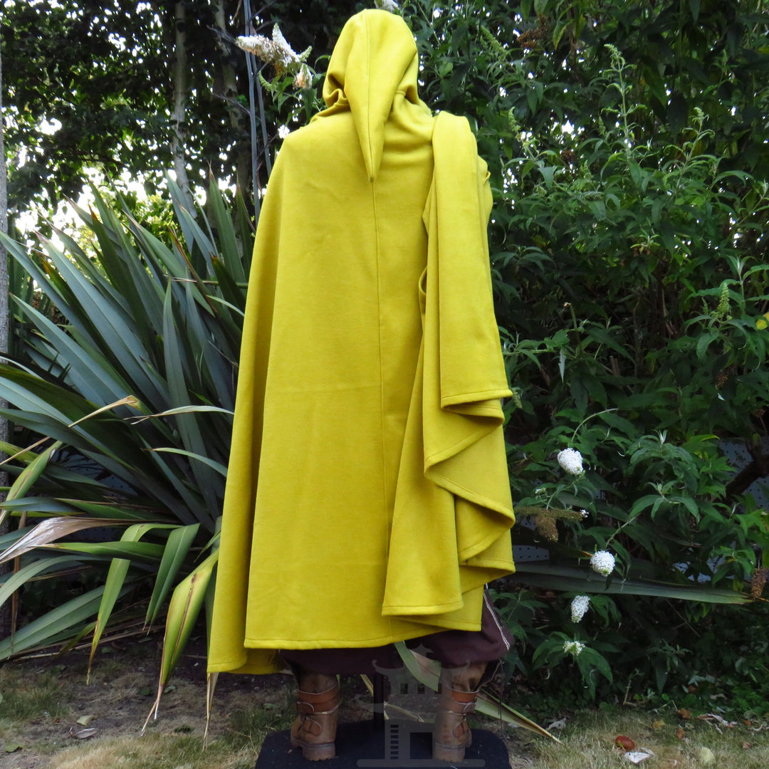 Side view of the mustard wool hooded cloak, hood up