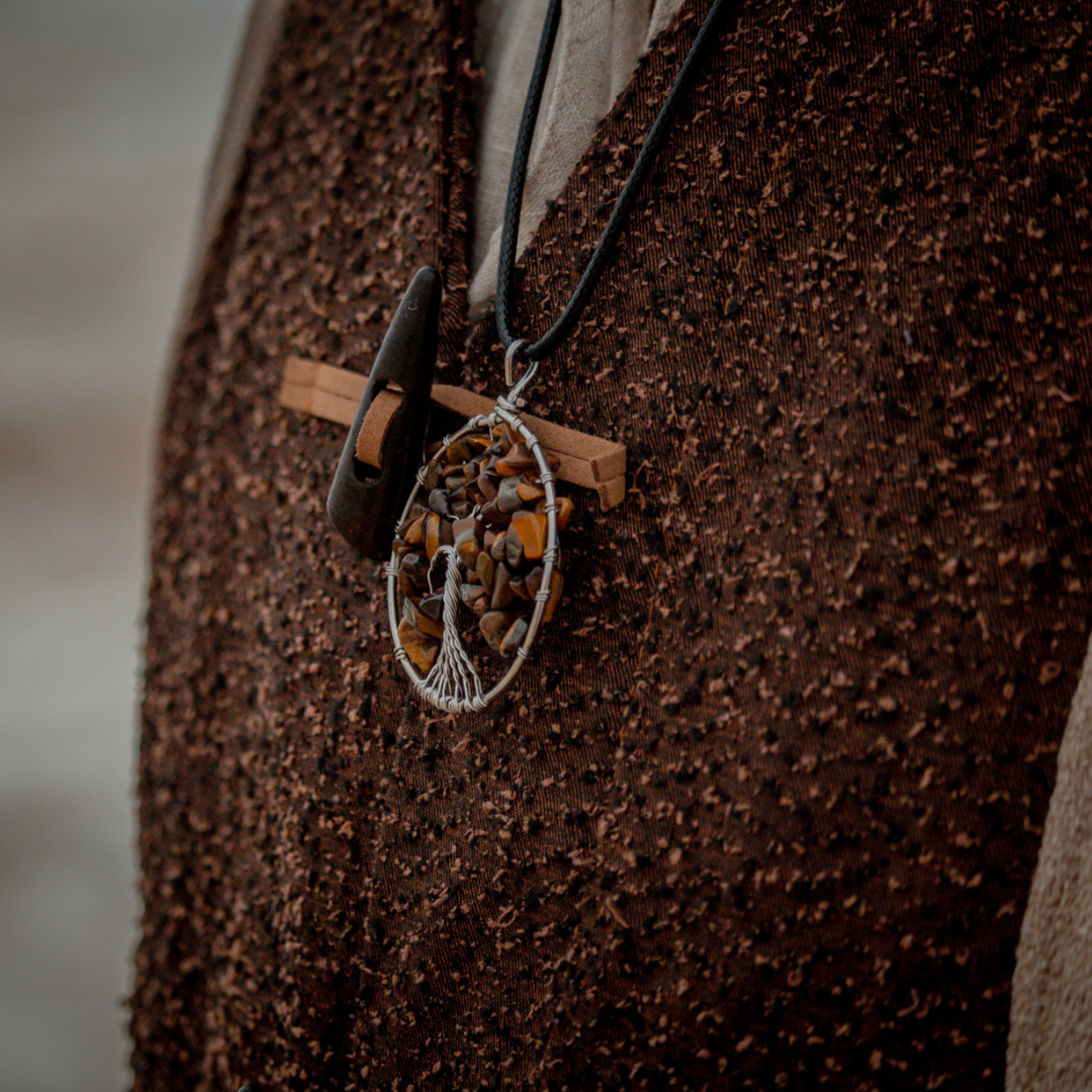 Bronze Tree of Life necklace with stones on textured fabric, LARP style.
