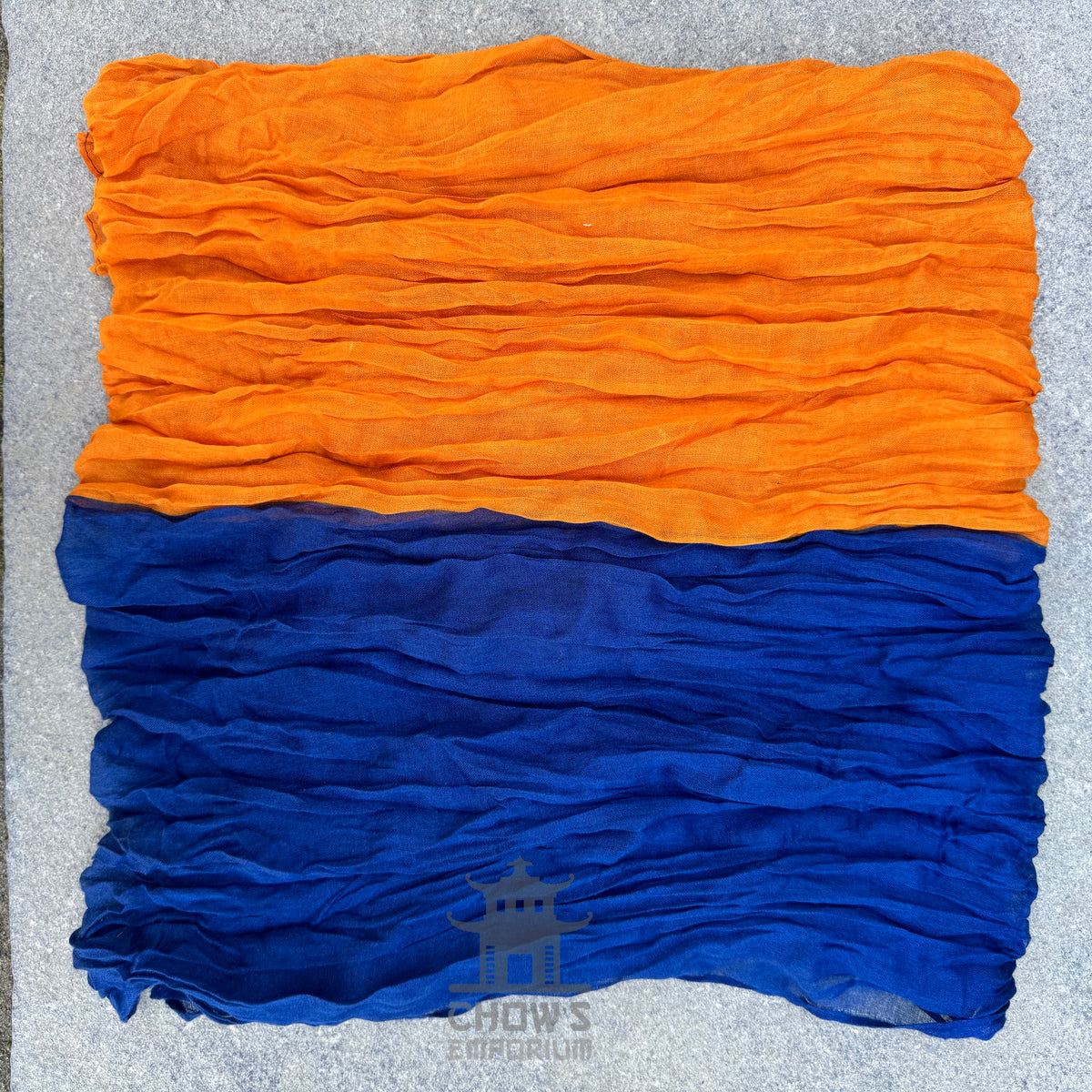 Folded Portal pirate sash showing navy blue and orange two-tone
