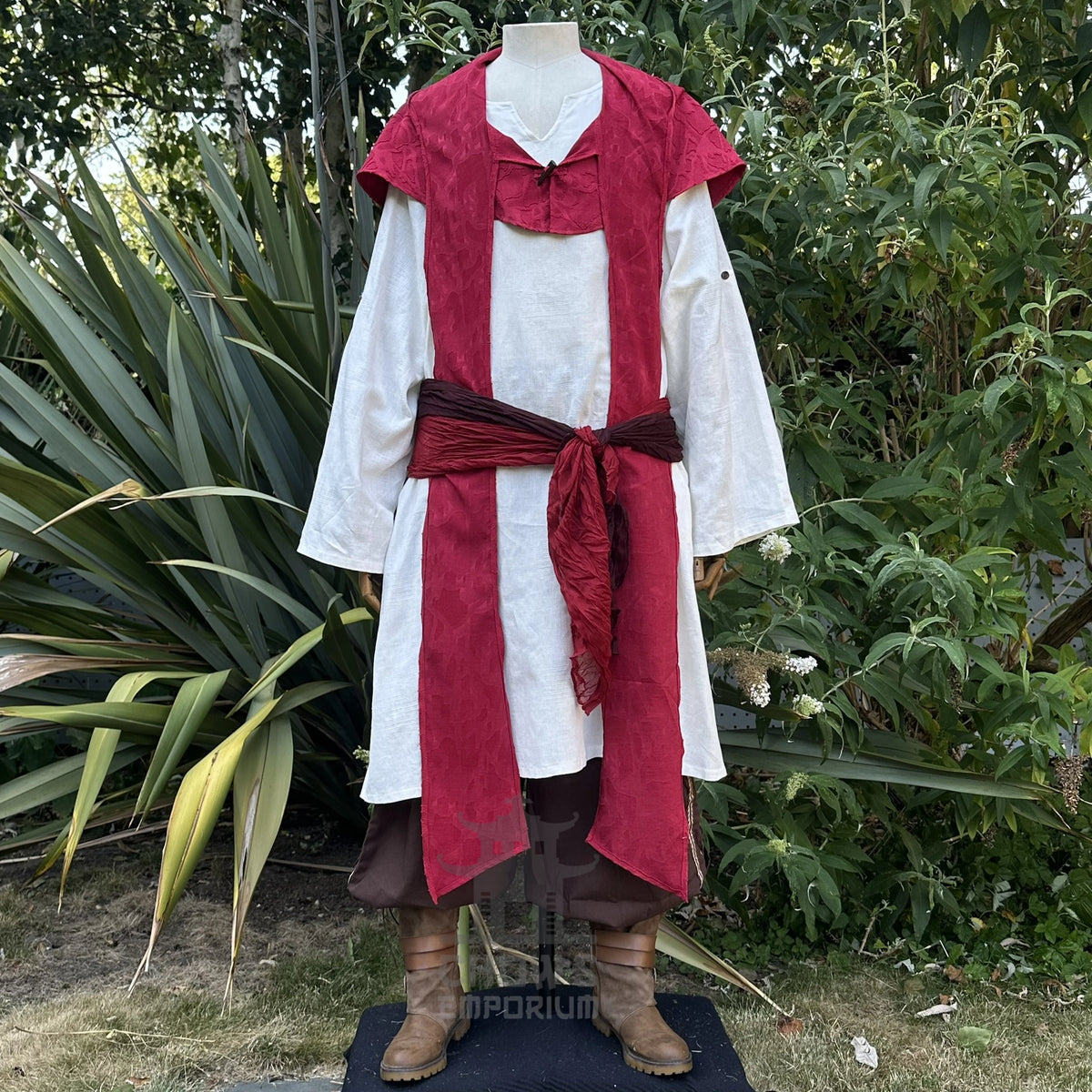 Red cotton scarf hood with the ends hanging loose at the front