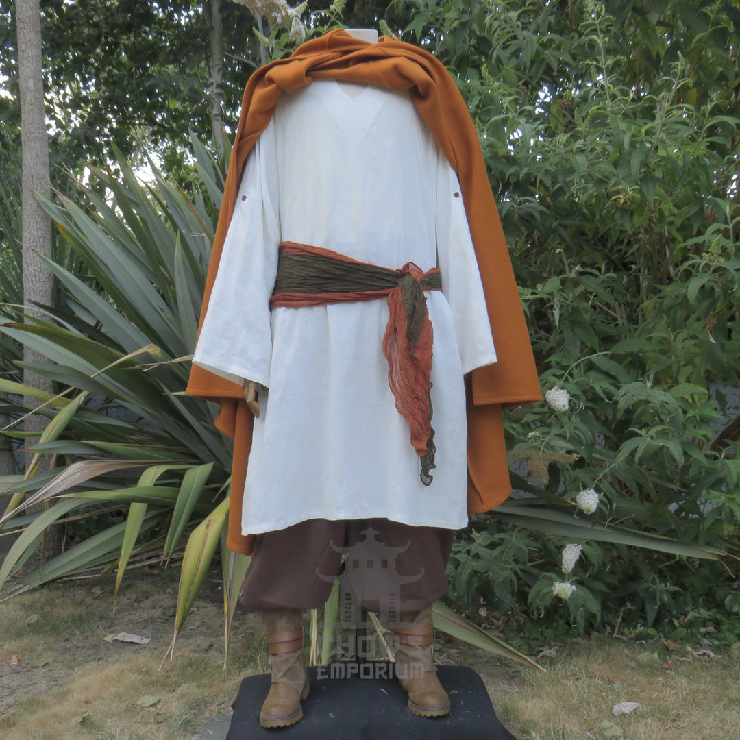 Rust cloak draped back over both shoulders showing the costume underneath, other pieces sold separately