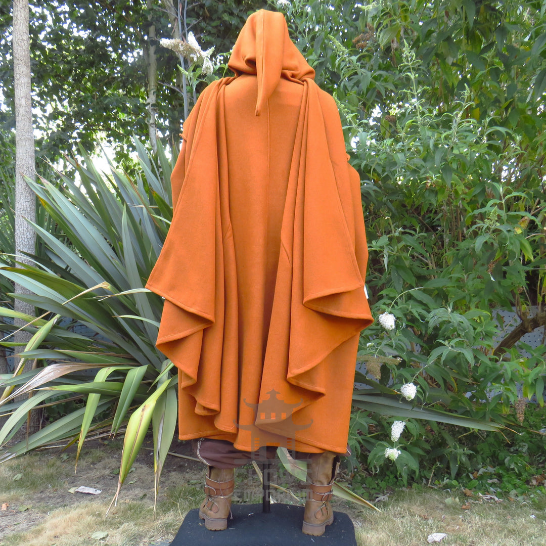Back view of the rust wool cloak with the hood up and the full drape falling behind