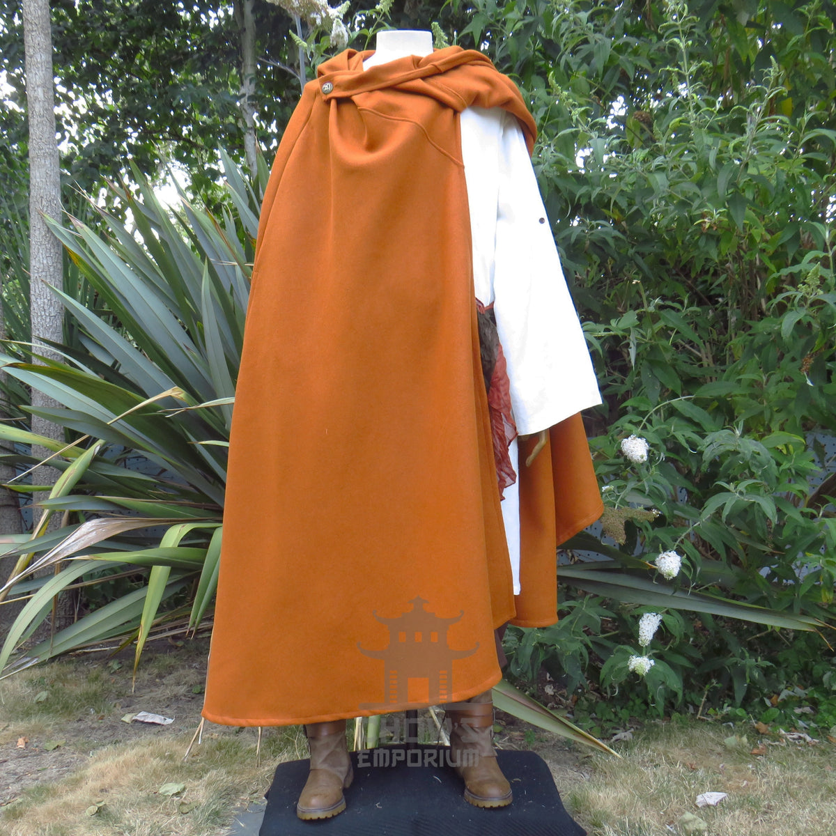 Rust medieval cloak swept back over one shoulder, tunic and sash sold separately