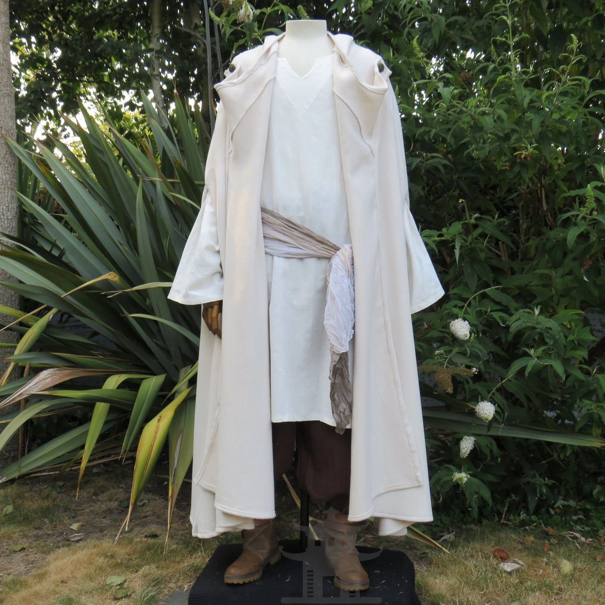 White wool cloak worn open as part of a pale layered costume, other pieces sold separately