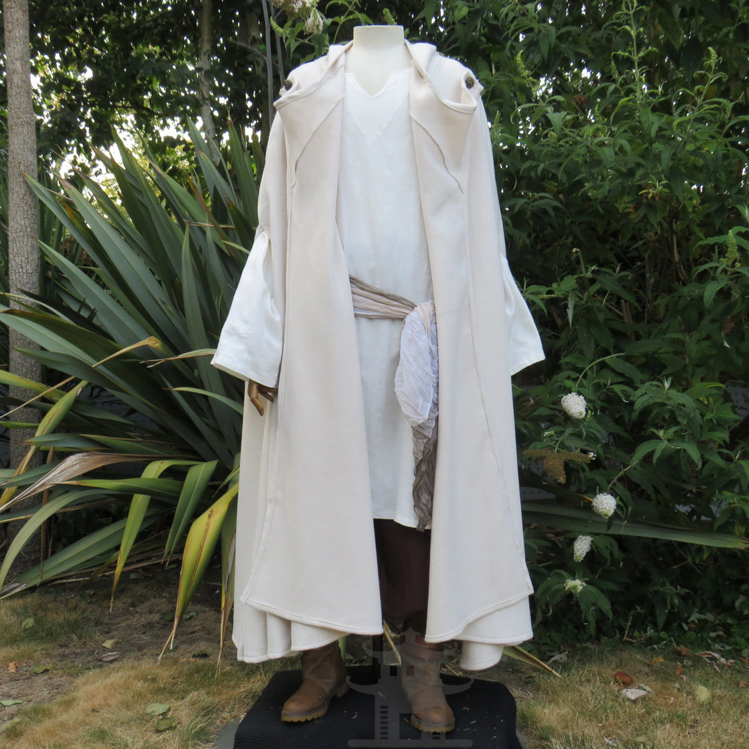 White cloak styled open over a pale tunic, tunic sold separately