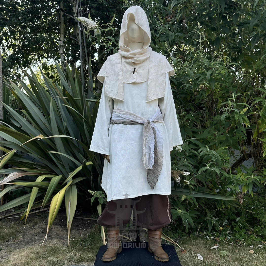 White scarf hood worn as a cowl round the shoulders over a tunic