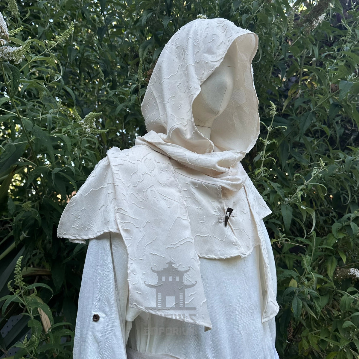 White medieval snood wrapped over the face and neck