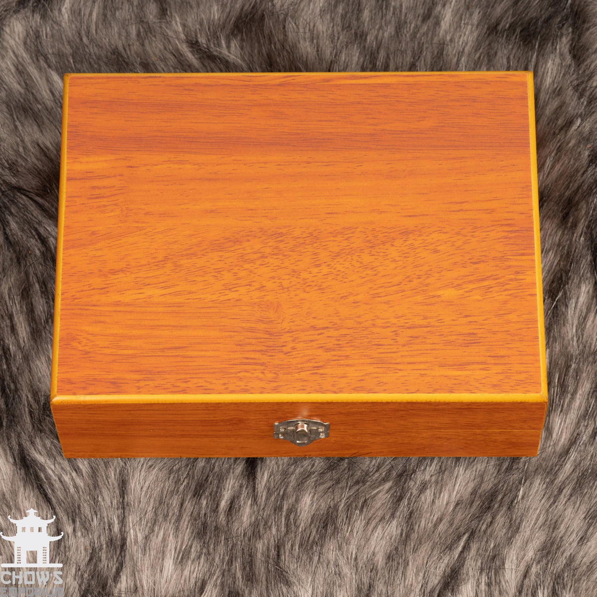 Ornate wooden box on fur, closed view for LARP.
