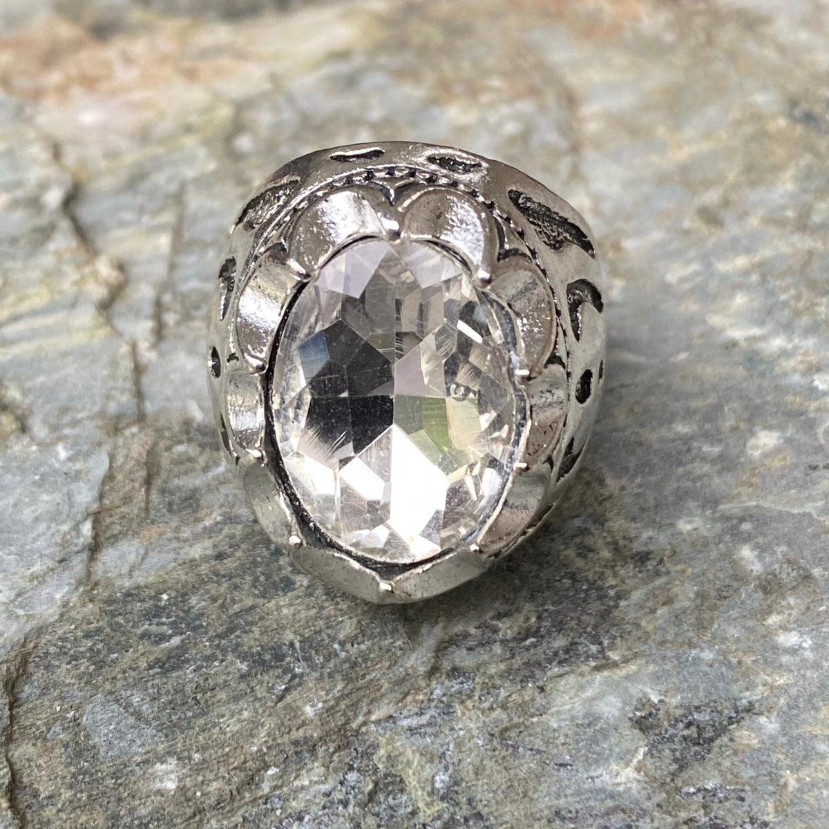 Intricately carved silver ring with faceted gemstone for LARP.
