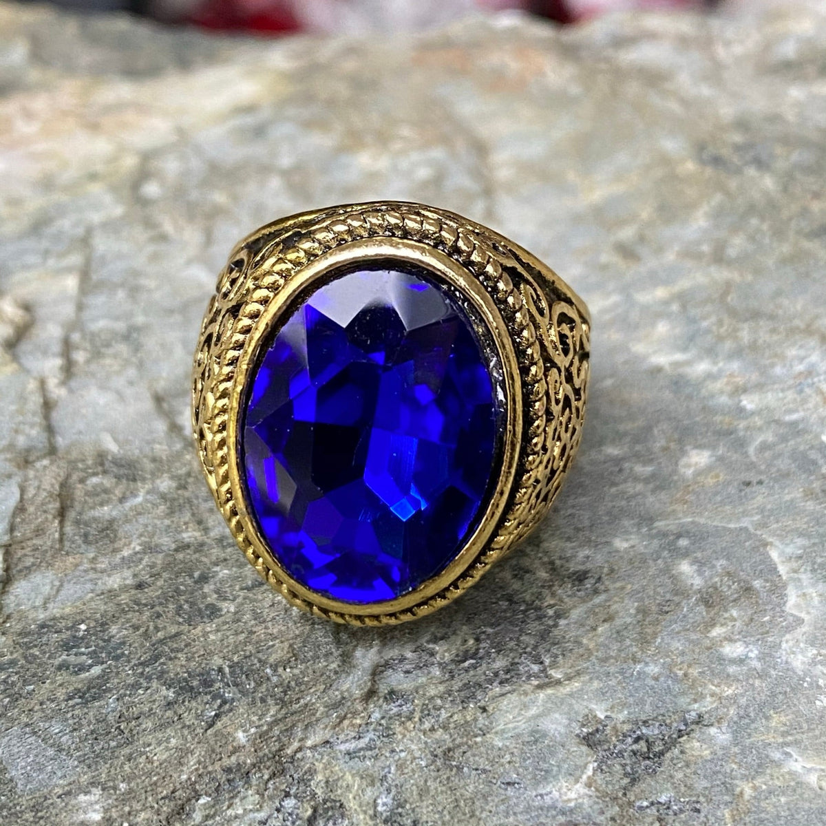 Ornate gold ring with deep blue gemstone for LARP.