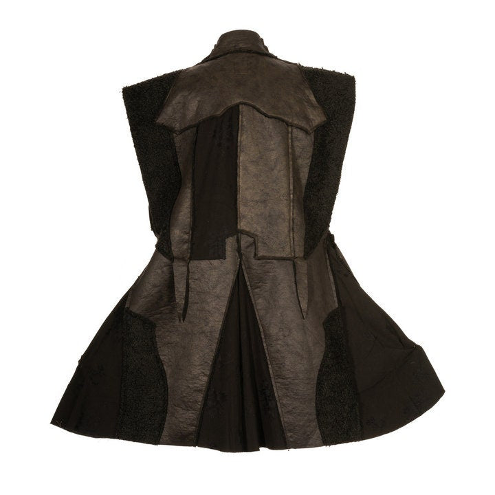 Back view of black faux leather LARP waistcoat with patchwork panels.