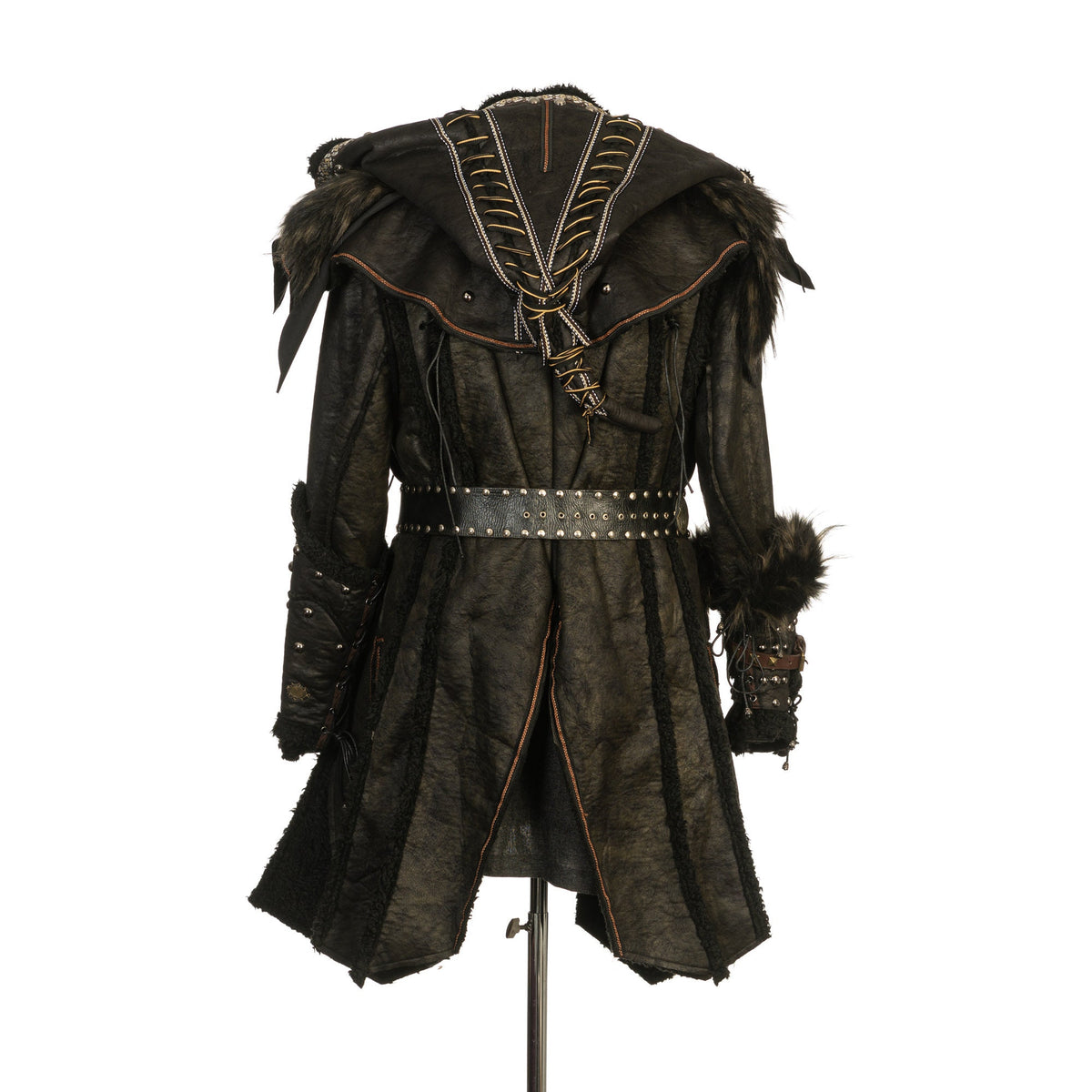 Back view of medieval LARP set with belted jacket and fur-trimmed vambraces.
