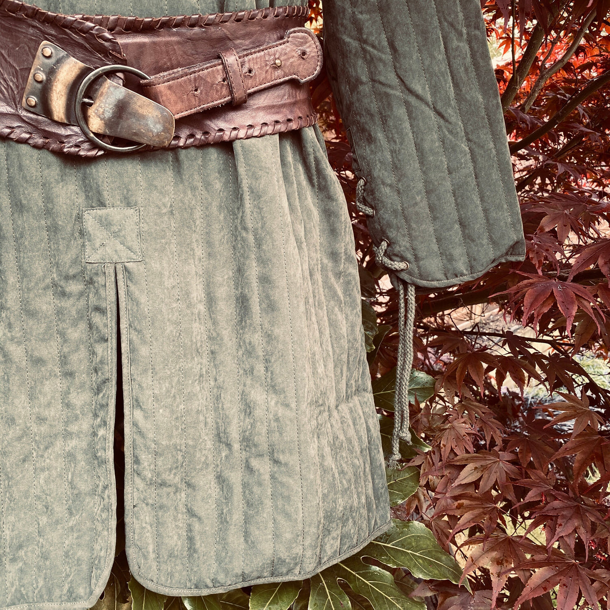 close up padding detail on green gambeson tunic for LARP.