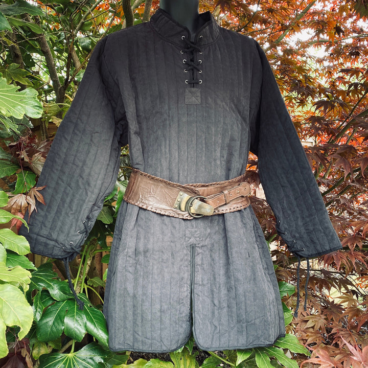This Thin LARP Gambeson comes in Grey Cotton. This Padded Tunic can sit on top of the rest of your kit. This Lightweight Gambeson is water resistant and keeps you warm. This Viking Tunic is perfect for your LARP Costume and LARP Character, Cosplay Events, and Ren Faires.