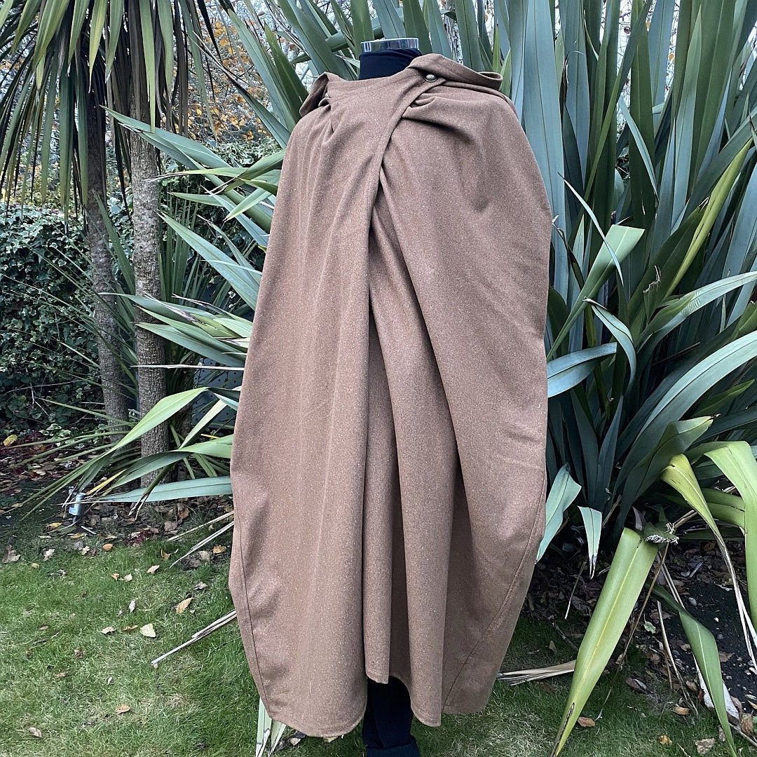 Brown medieval wool cloak displayed on mannequin in.