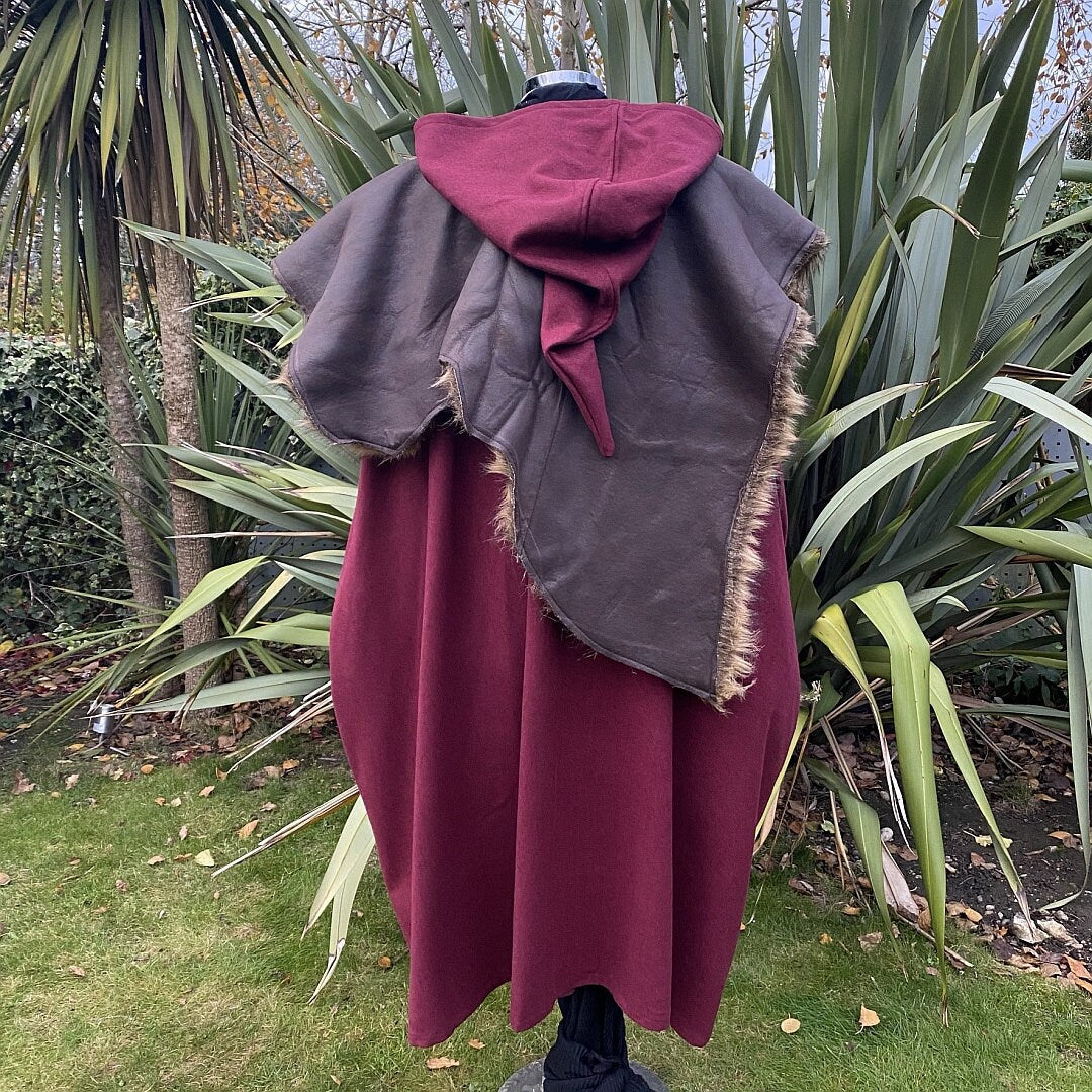 Cloak set rear view showing red wool and fur mantle in a medieval LARP.