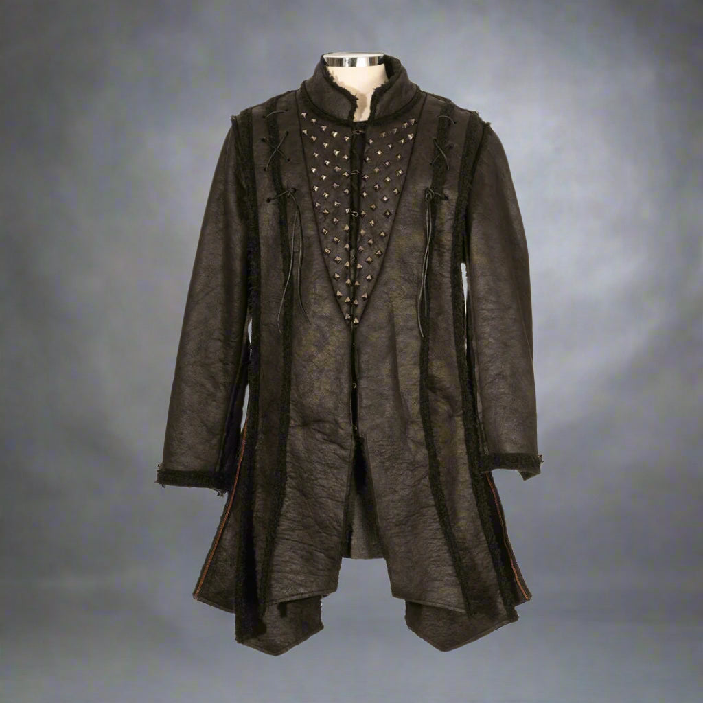 Front view of black faux leather Viking coat with metal studs, LARP warrior jacket loose.