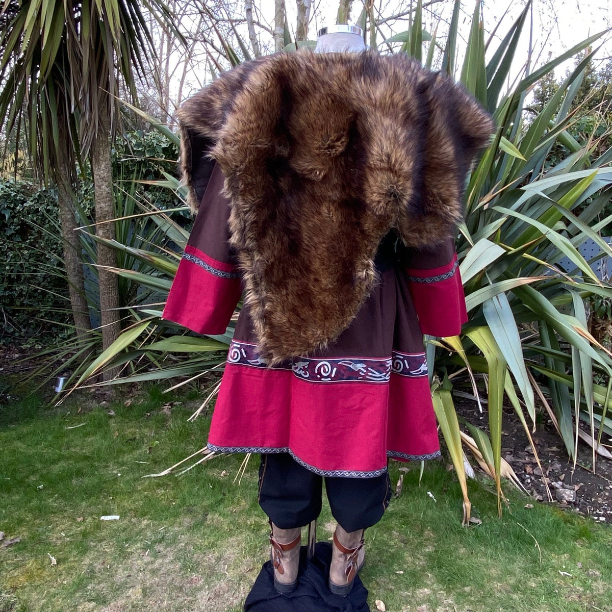 Rear view of LARP outfit with red tunic, brown fur mantle.