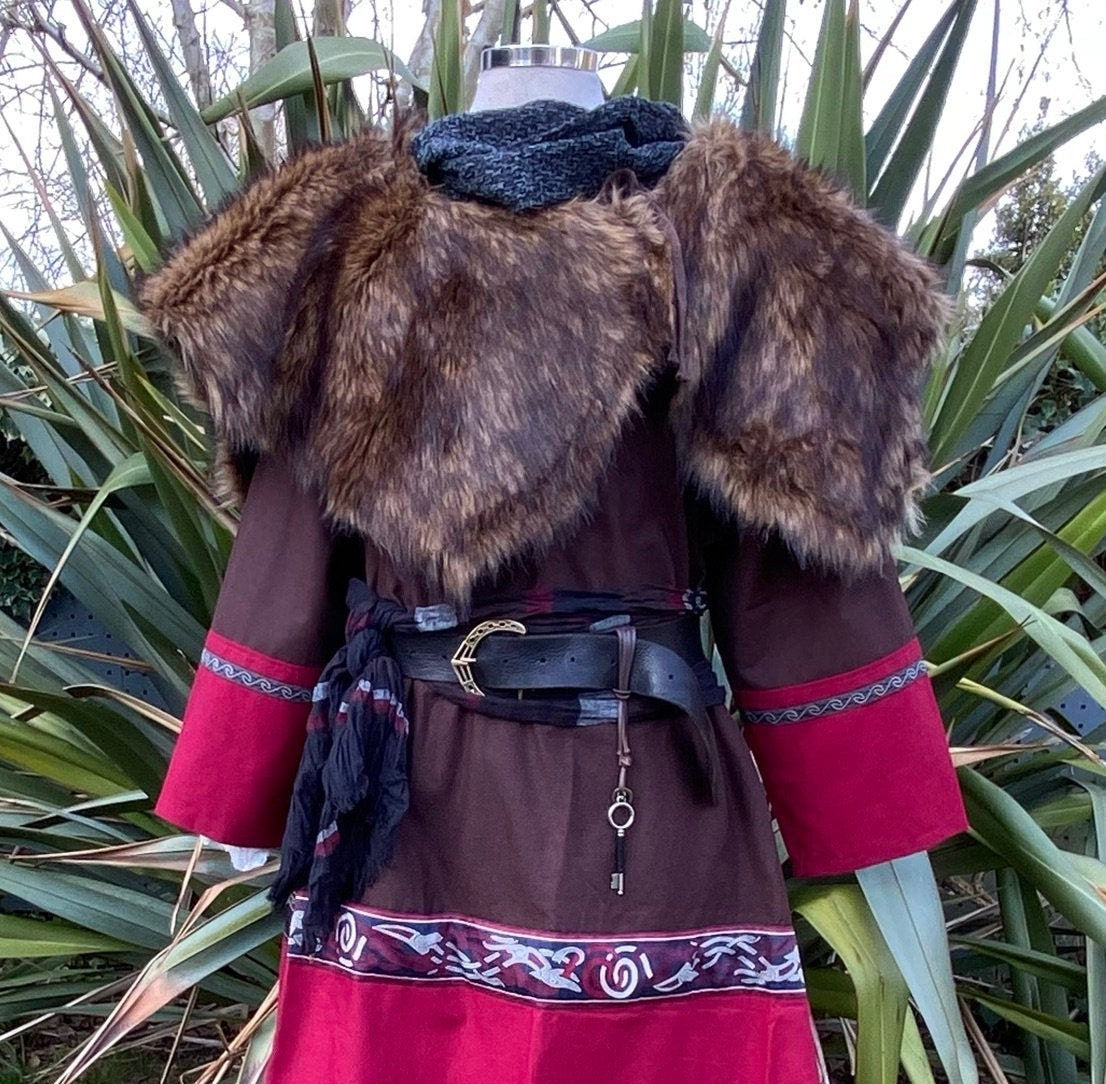 Medieval LARP costume rear view with faux fur mantle and ornate belt.