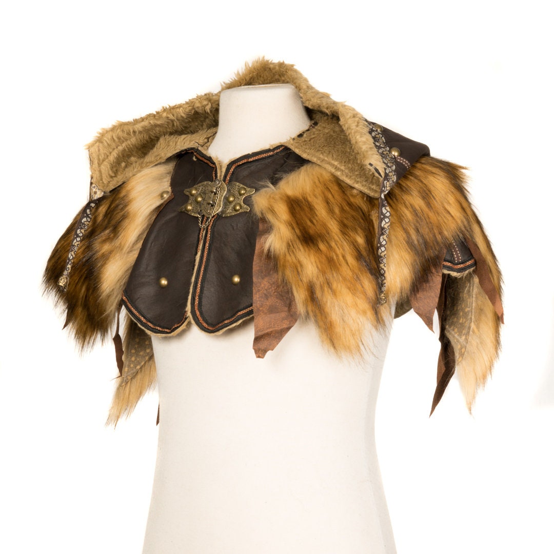 This Ornate LARP Hood and Leather Vambrace comes as a set. The LARP Hood comes in Brown Faux Leather with Brown Faux Fur Trim, with Fleece Lining. The LARP Armor Leather Vambraces are Brown Faux Leather and has Brown Faux Fur. Perfect for your LARP Character and LARP Costume, Cosplay Event, and Ren Faire.