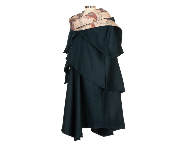 This Layered Woollen LARP Cloak in Teal has multiple tiers of folded fabric to keep you warm and enhance your kit. The Viking Cloak has a Hood attached that, along with the LARP Cloak, keep you warm and dry. The Medieval Cape has an Elaborate Lining to add flare to your LARP Character, Cosplay Event, or Ren Faire. 
