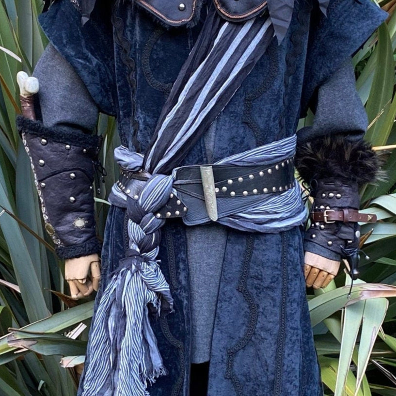 Medieval LARP vambraces with metal studs, viewed from front waist angle.