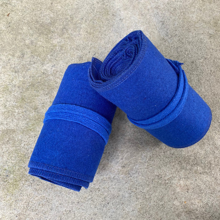 Set of Medieval LARPing Leg Wraps. They are Blue and made out of a Wool mixture which are used to keep Trouser flares out of the way and legs warm. These Viking Wraps can wrap around your Legs to provide an extra flare to LARP kit.