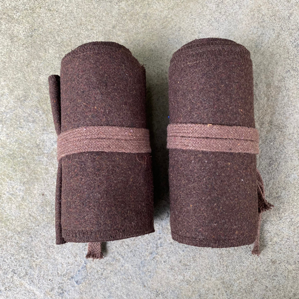 Set of Medieval LARPing Leg Wraps. They are Brown and made out of a Wool mixture which are used to keep Trouser flares out of the way and legs warm. These Viking Wraps can wrap around your Legs to provide an extra flare to LARP kit.
