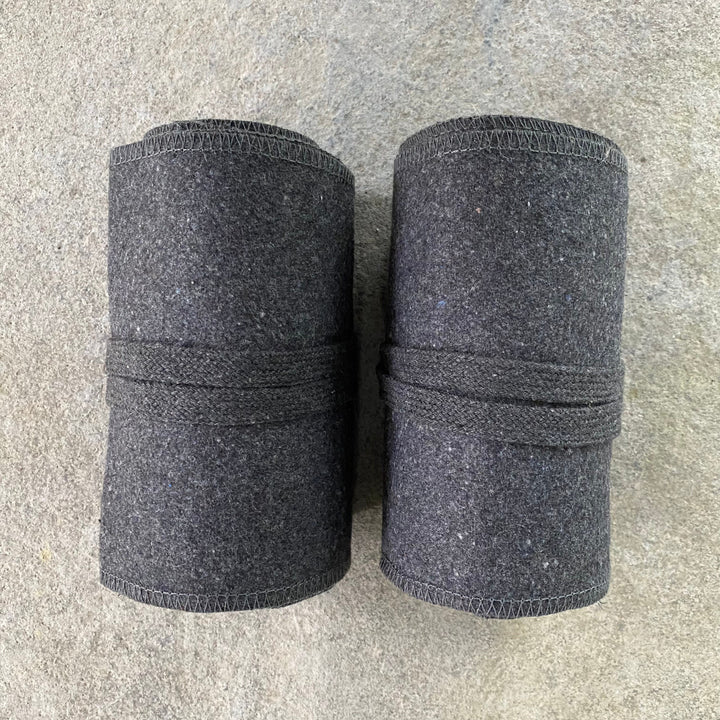 Set of Medieval LARPing Leg Wraps. They are Dark Grey and made out of a Wool mixture which are used to keep Trouser flares out of the way and legs warm. These Viking Wraps can wrap around your Legs to provide an extra flare to LARP kit.