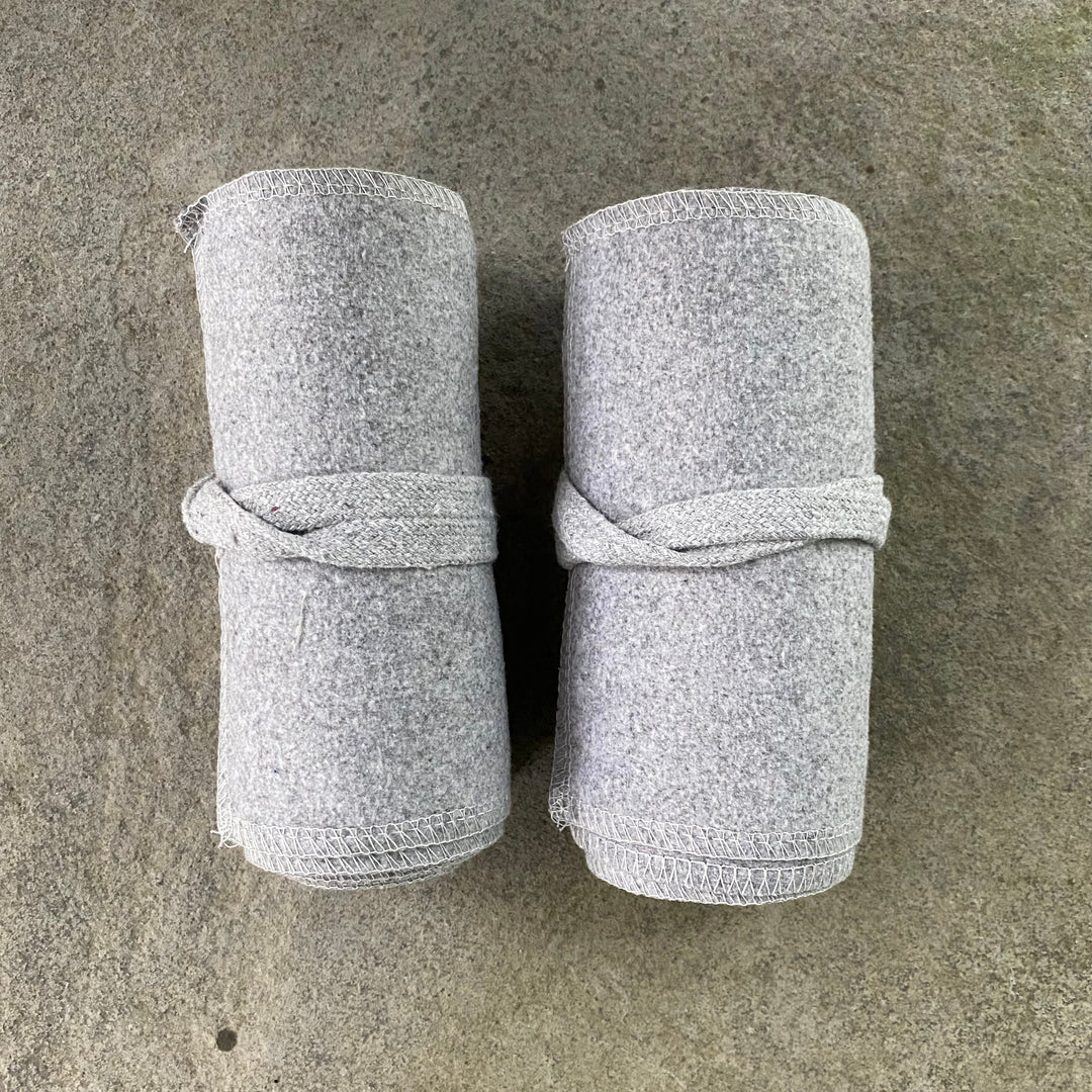 Set of Medieval LARPing Leg Wraps. They are White and made out of a Wool mixture which are used to keep Trouser flares out of the way and legs warm. These Viking Wraps can wrap around your Legs to provide an extra flare to LARP kit.
