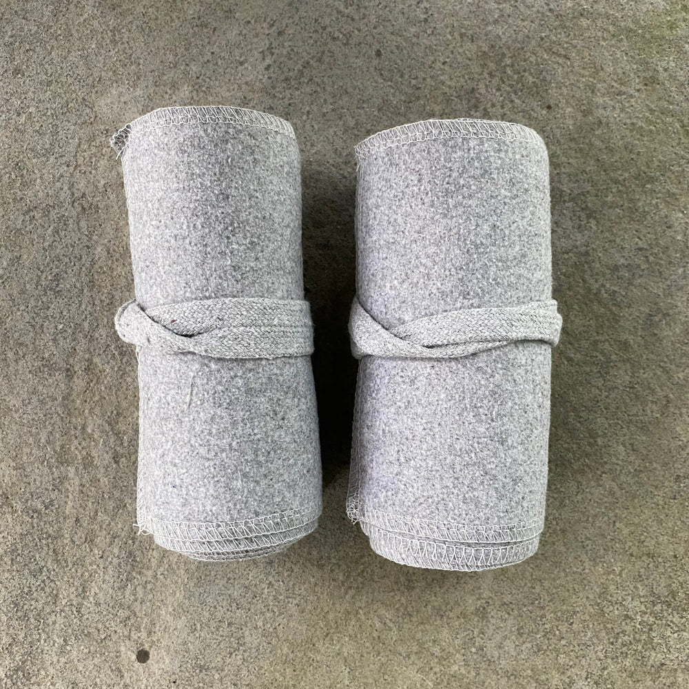 Set of Medieval LARPing Leg Wraps. They are White and made out of a Wool mixture which are used to keep Trouser flares out of the way and legs warm. These Viking Wraps can wrap around your Legs to provide an extra flare to LARP kit.