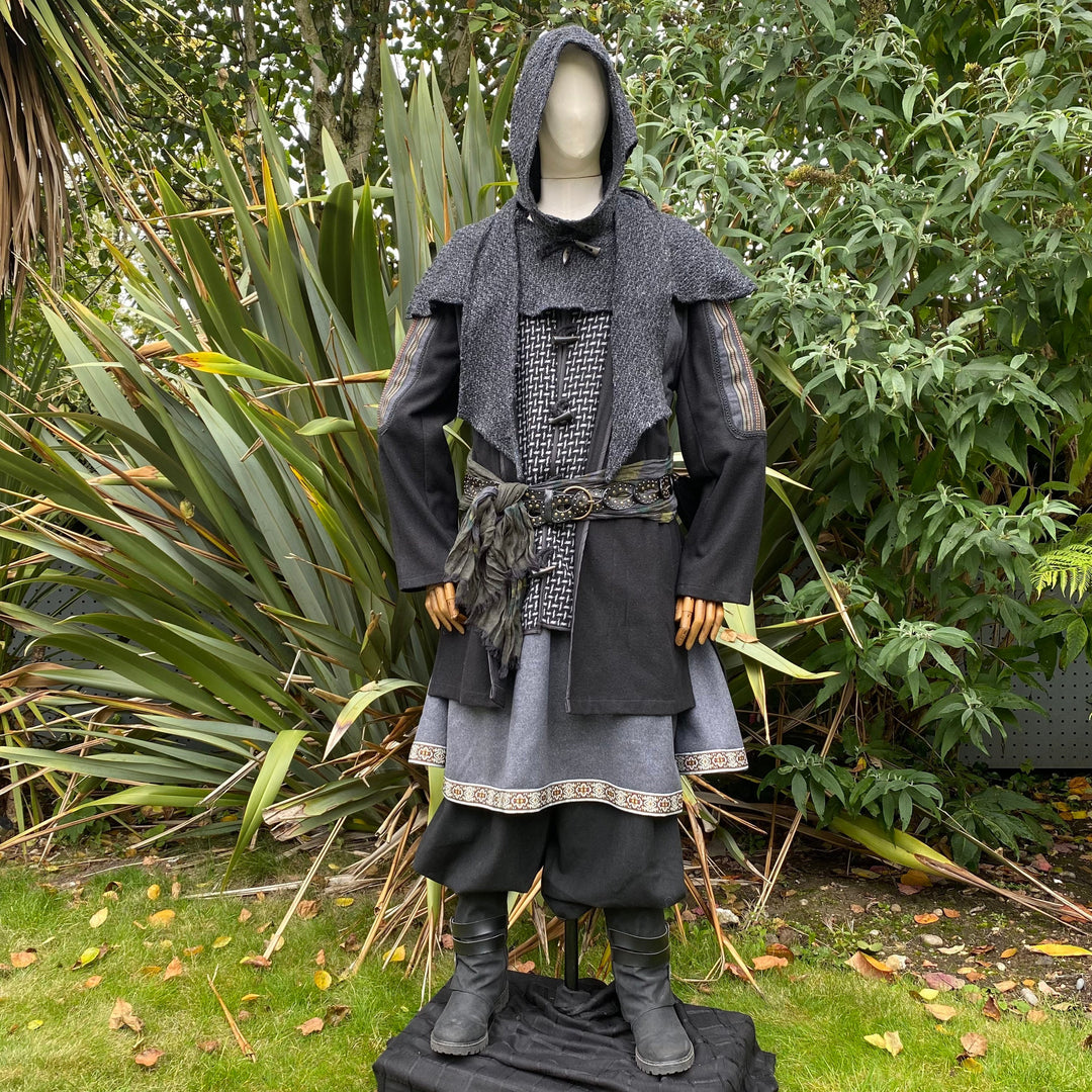 Medieval LARP costume with layered jacket and hood, side.