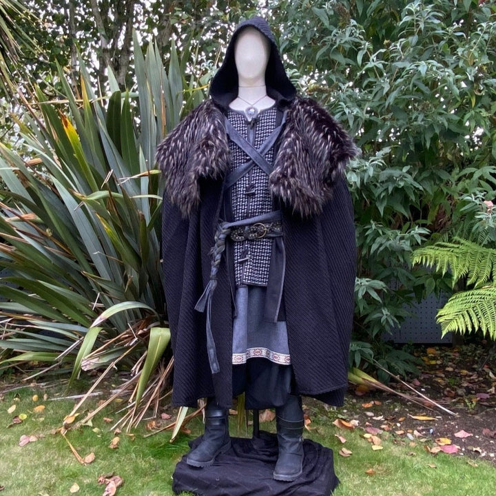 The Four Way LARP Cloak in Black Herringbone Wool with Reversable Faux Fur & Leather Brown Mantle is a Versatile Cape with Hood. The Medieval Cloak is Water Resistant and helps keep you warm. The Viking Style Cloak can be worn in four ways; perfect for your LARP character, Cosplay Events, and Ren Faires. 