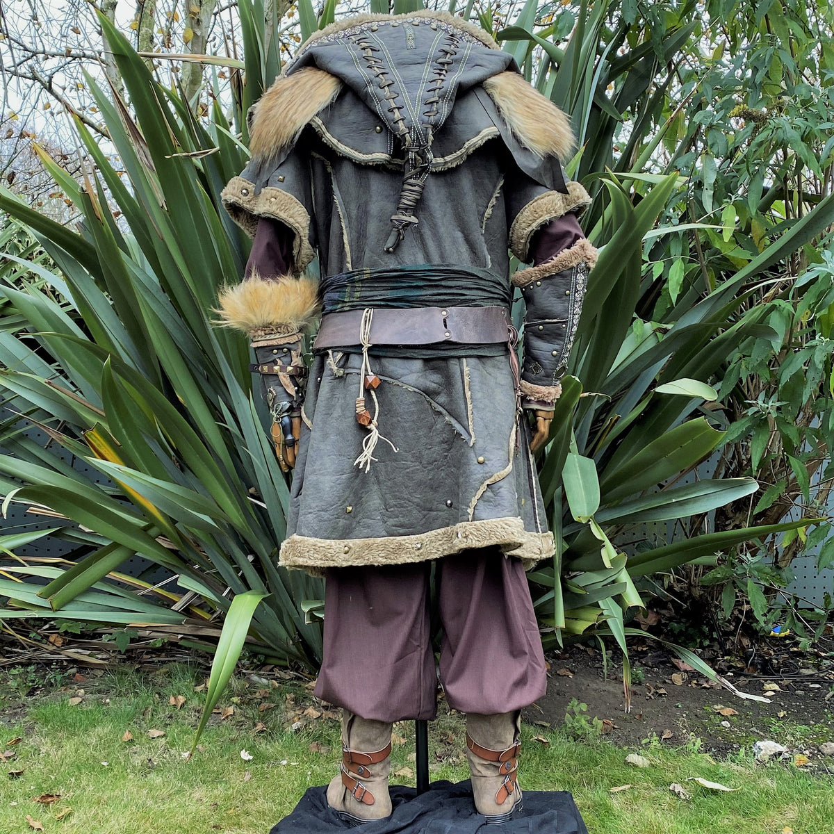 Barbarian LARP armor, rear view with fur details, hood, and rustic belt.