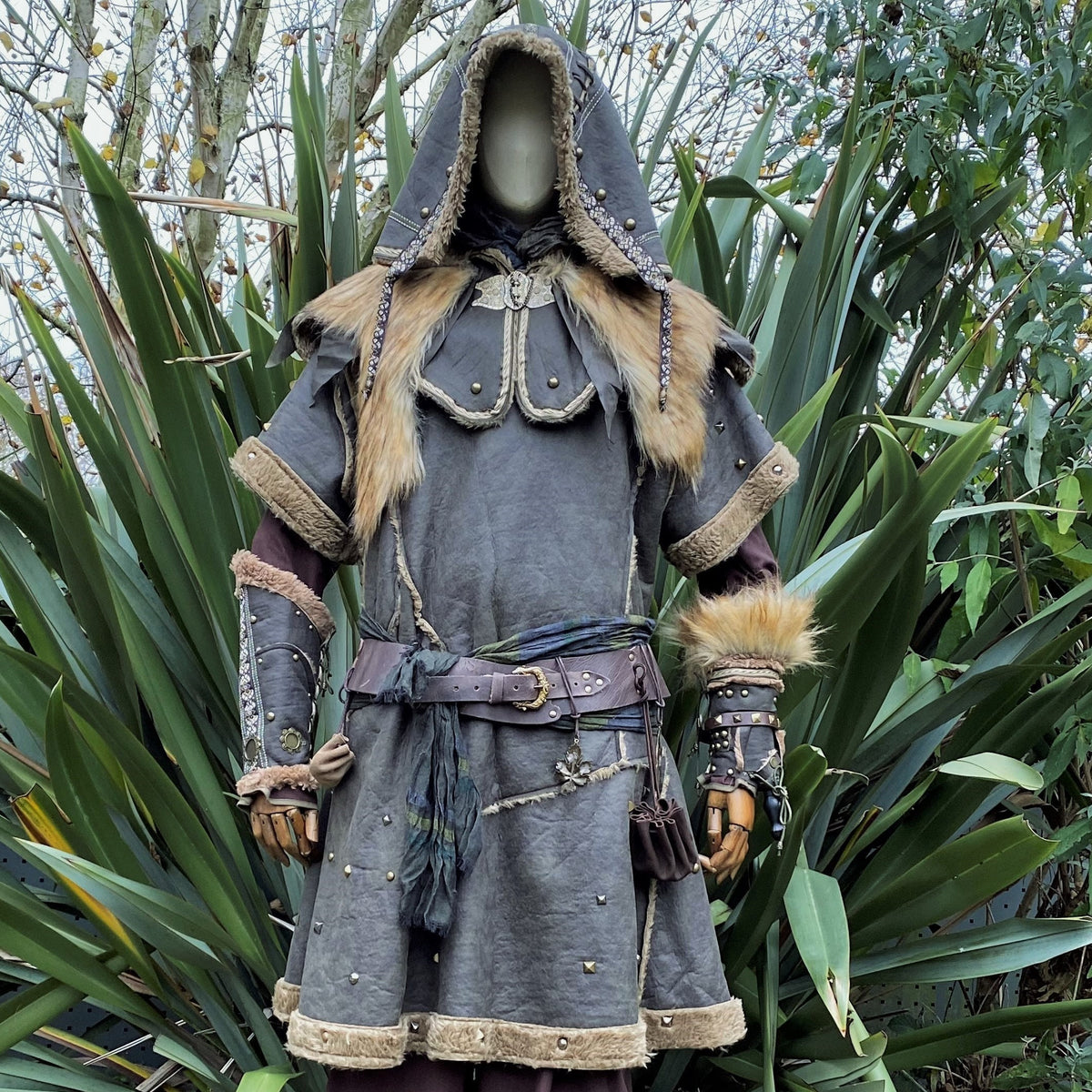 Medieval LARP set with hooded fur-trimmed jacket and detailed vambraces.
