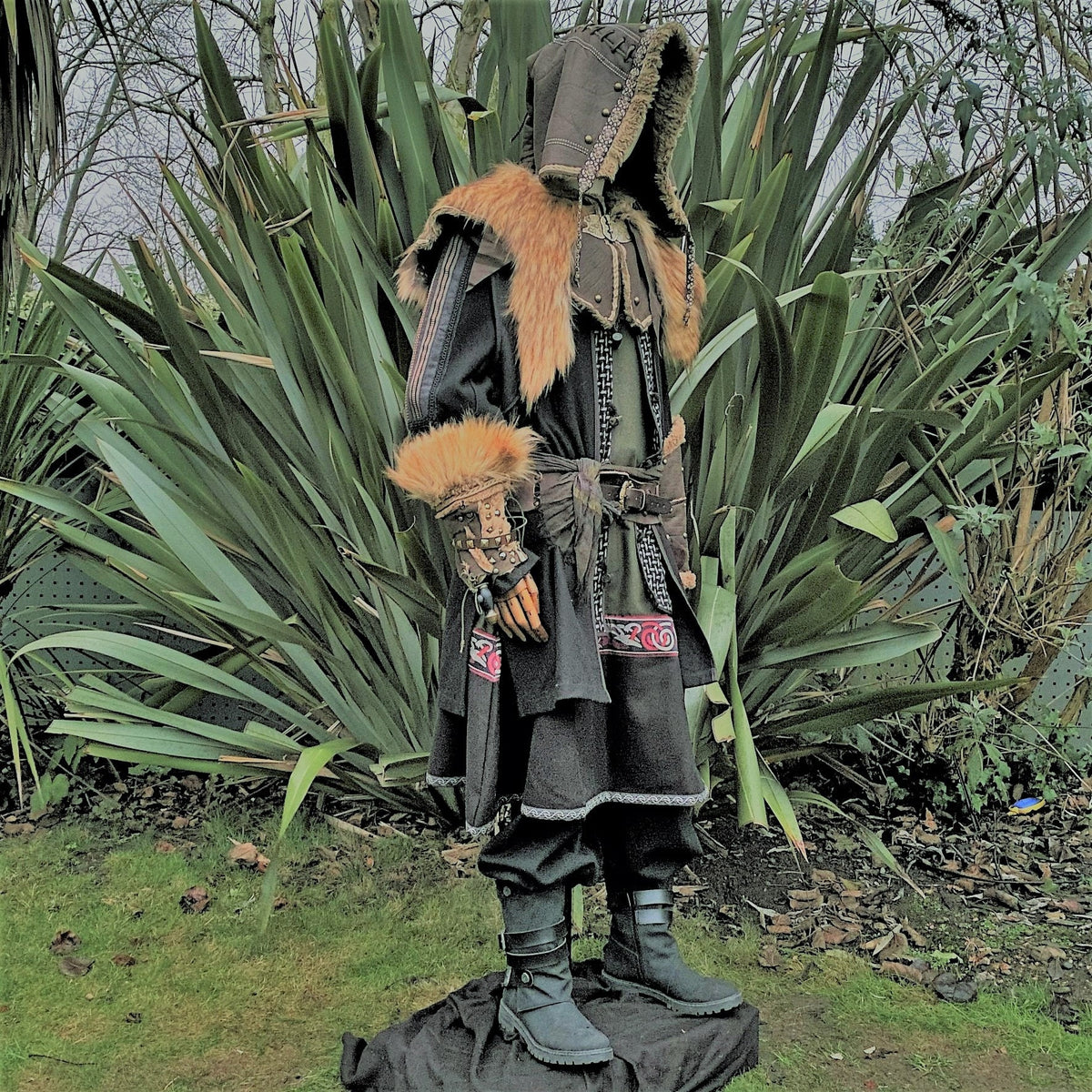 Medieval LARP outfit with fur trim, side view.