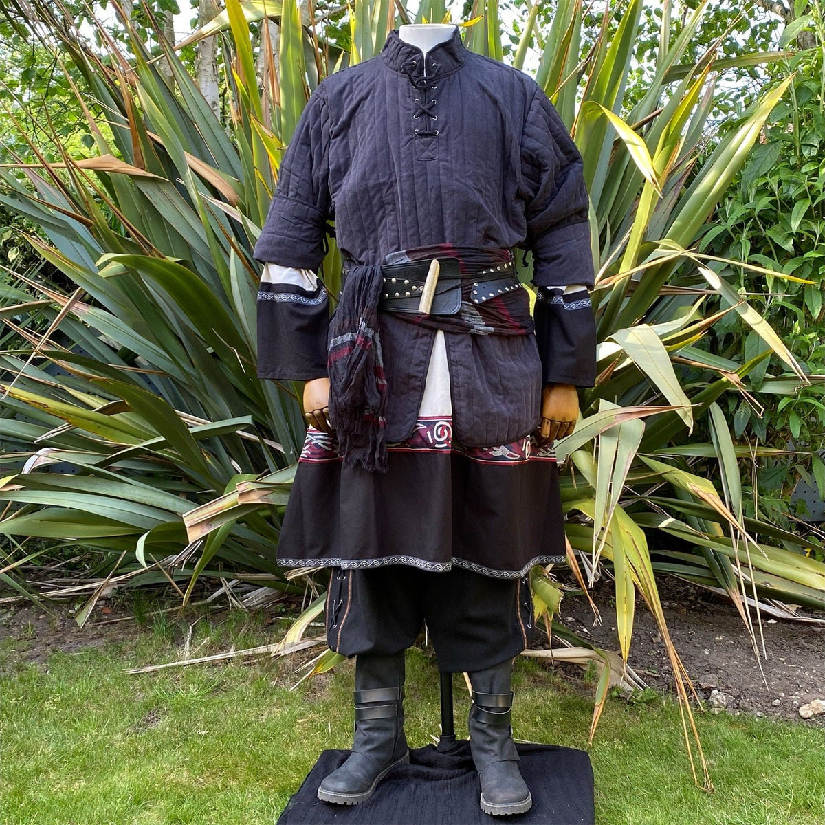 Medieval LARP attire, front view with black gambeson, tunic, and belt accents.