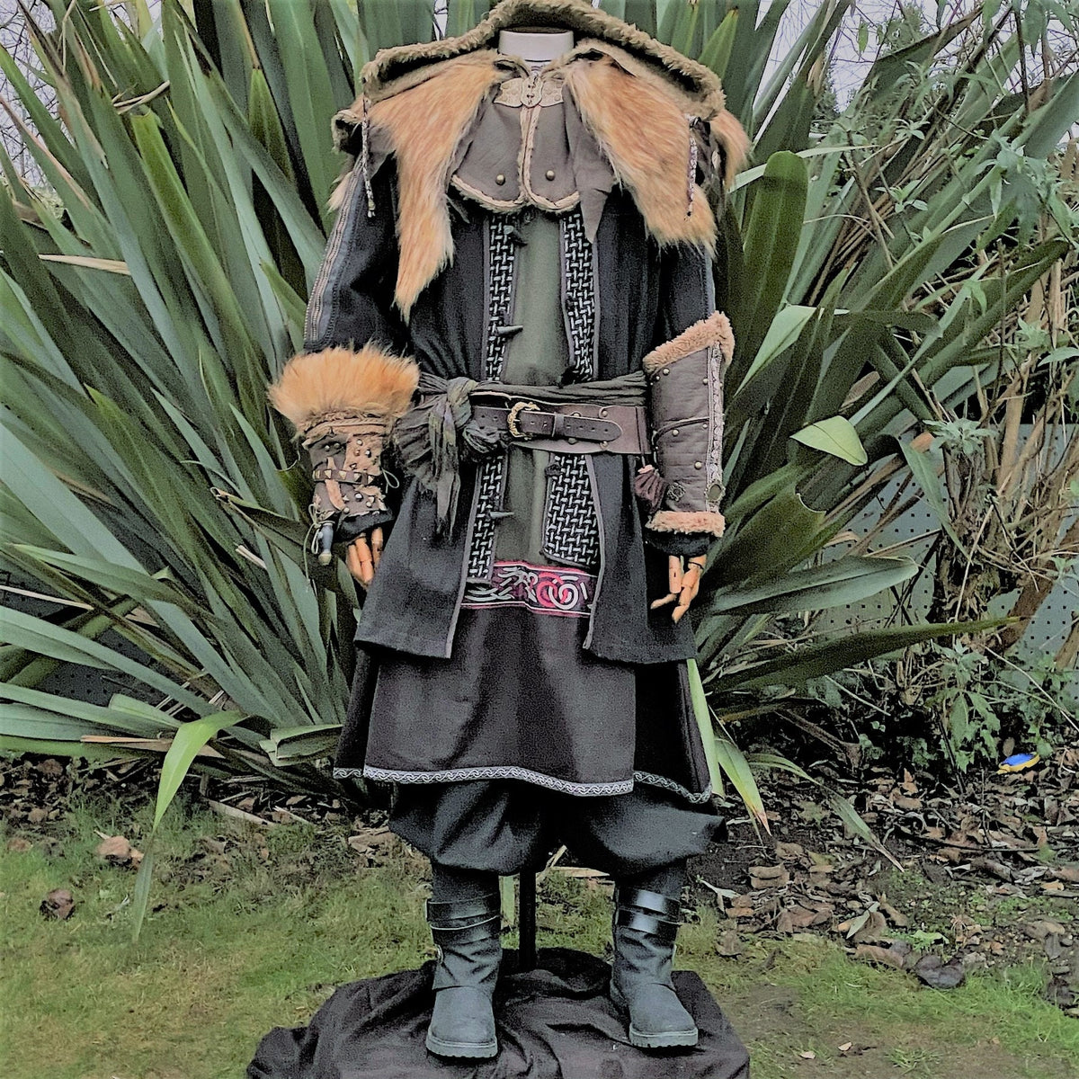Front view of medieval LARP outfit with fur details and intricate trim.