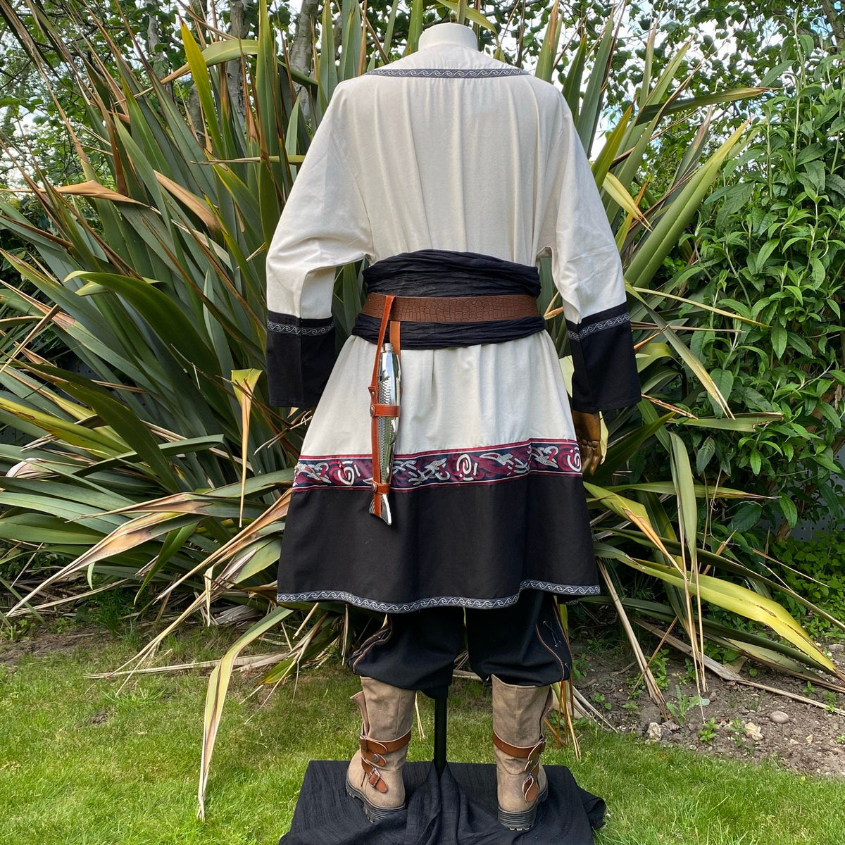 Back view of LARP medieval ensemble with tunic, belt, and dagger detail.