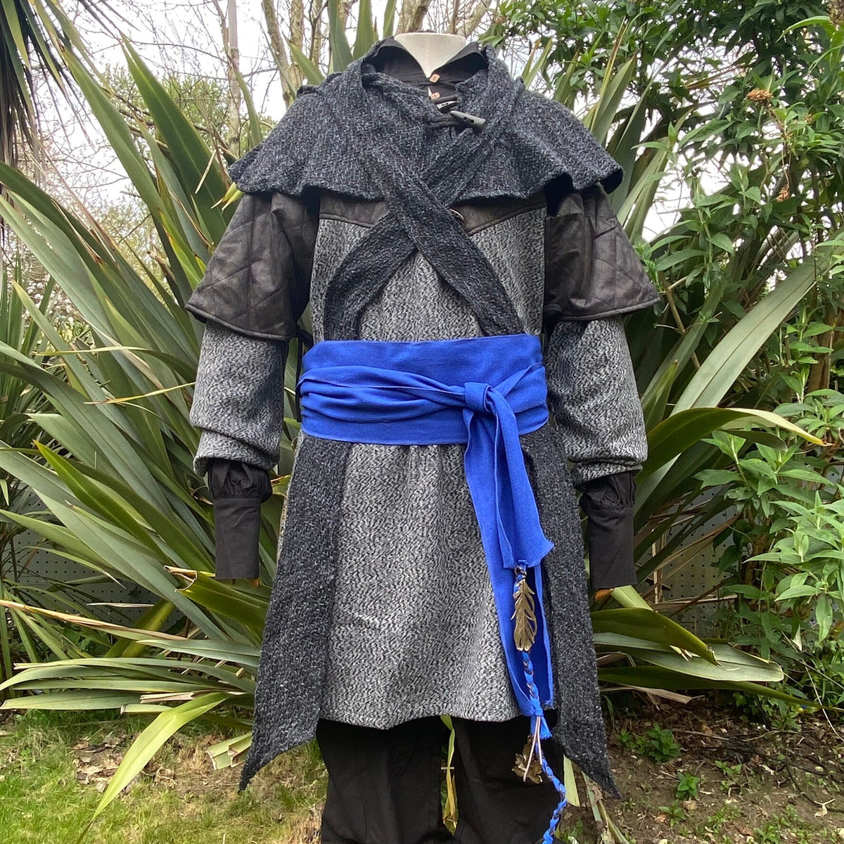 Blue wool LARP sash tied on dark tunic with feather detail.