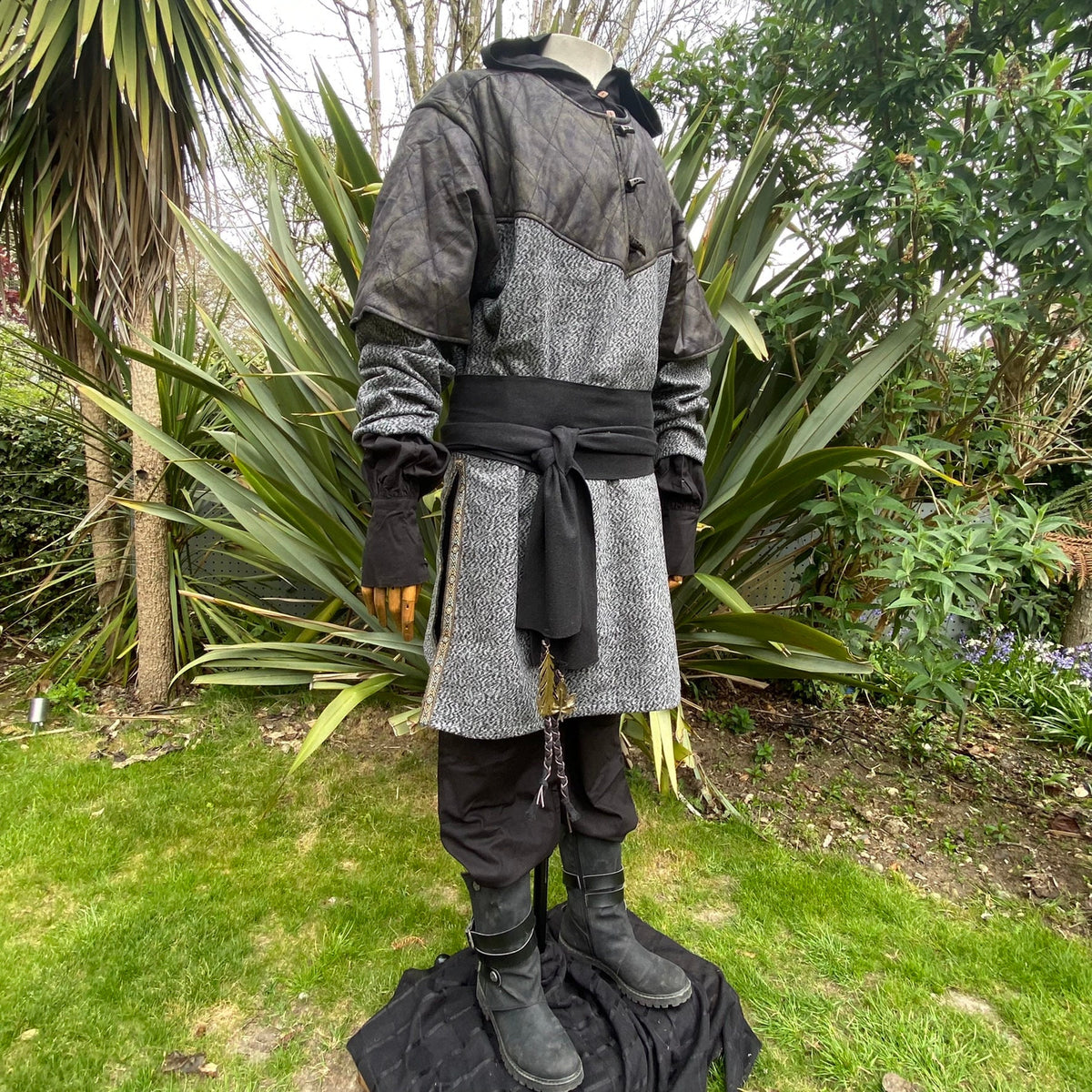 Medieval black wool sash on tunic, layered.