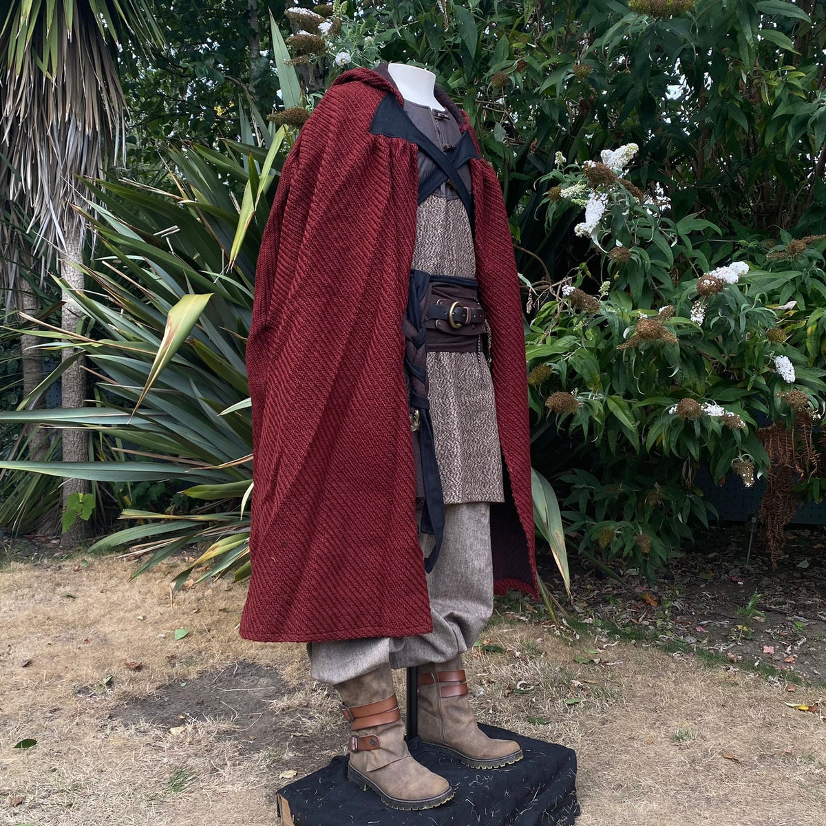 LARP Viking warrior outfit side view, red cloak, tunic, trousers.