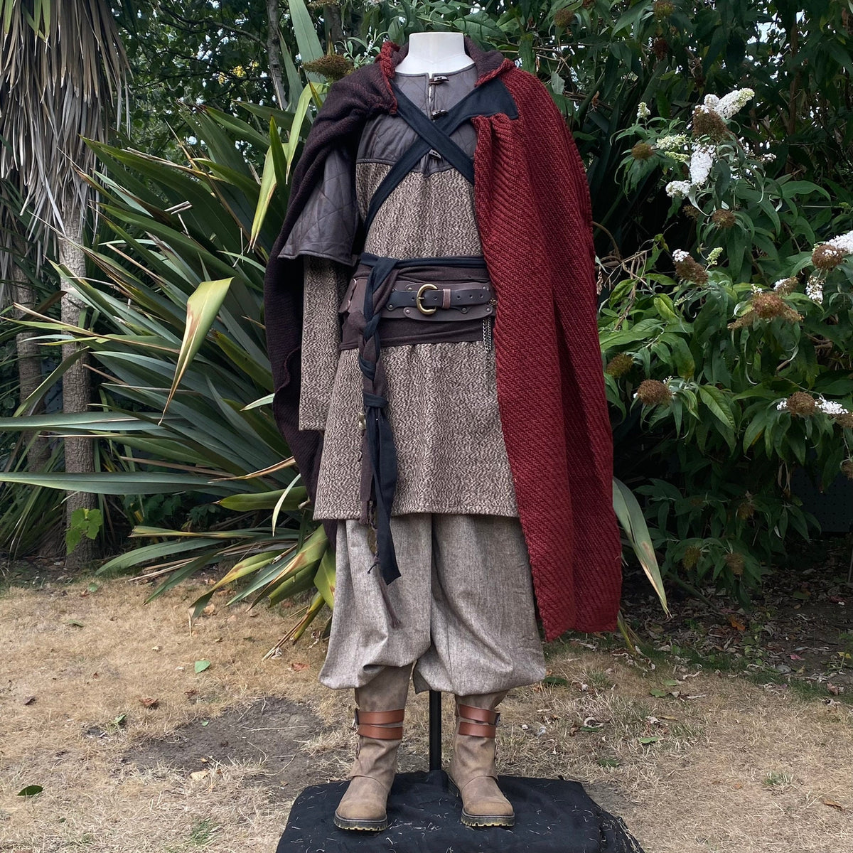 Viking LARP outfit front view: red-cloaked mannequin.