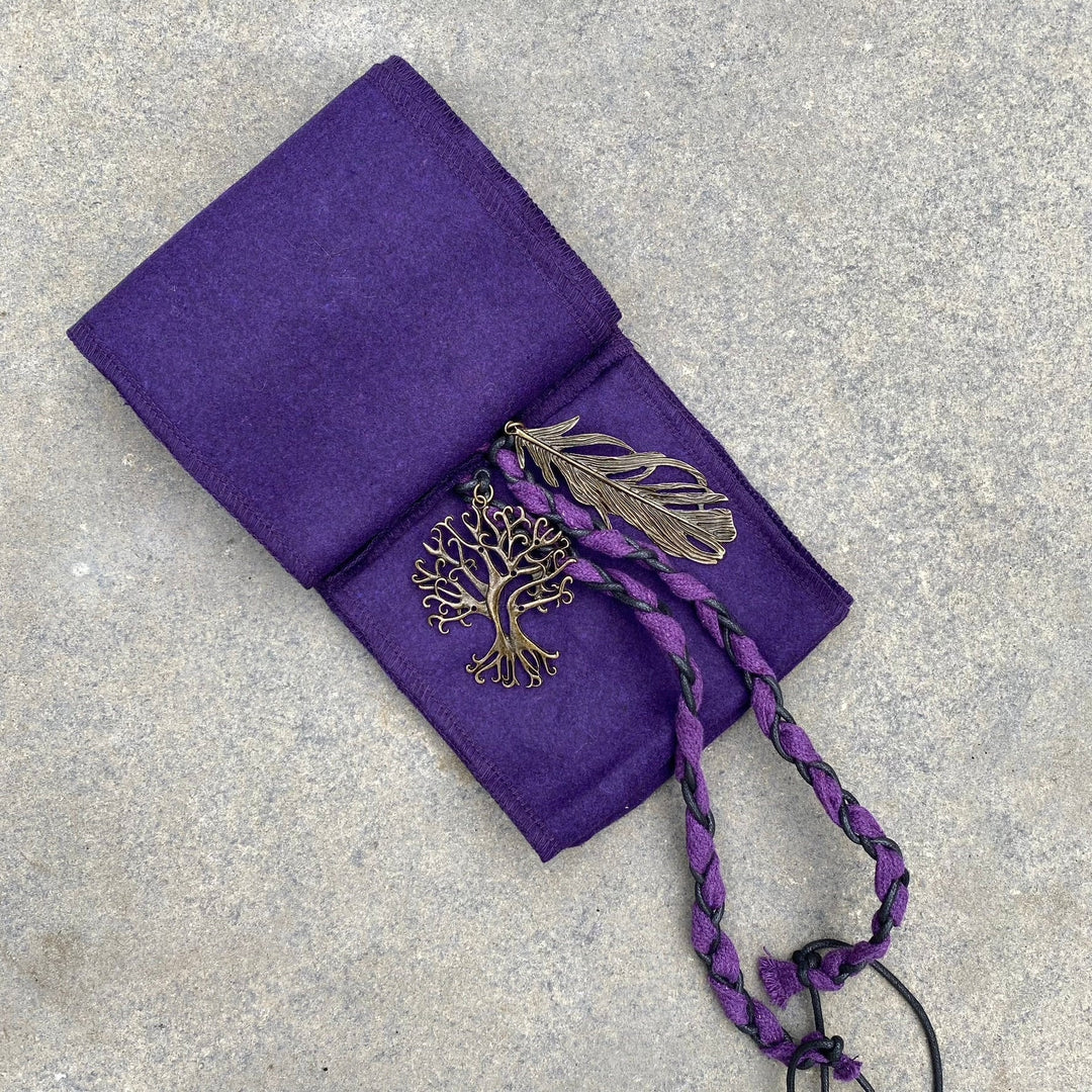 A Purple Wool LARP Sash. The Viking Sash is a Woollen sash that works well by itself, or underneath a LARP Belt. The LARP Sash is 300cm long, and can comfortably wrap around you. The Medieval Sash has a decorated metal accessories that adds to your LARP Character, Cosplay, or Ren Faire event.
