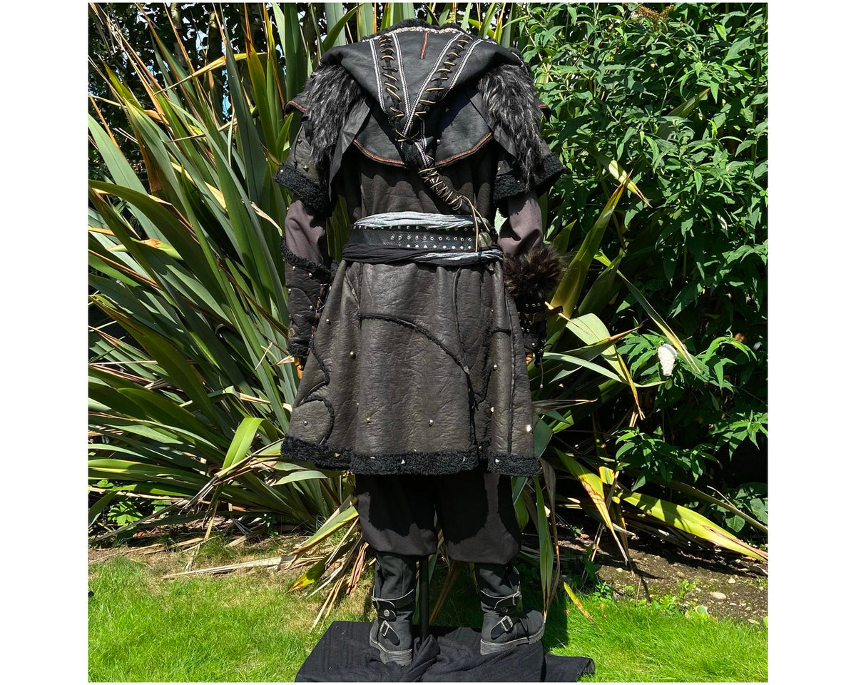 Back view of black faux leather LARP armor, tunic, hood, trousers, boots.
