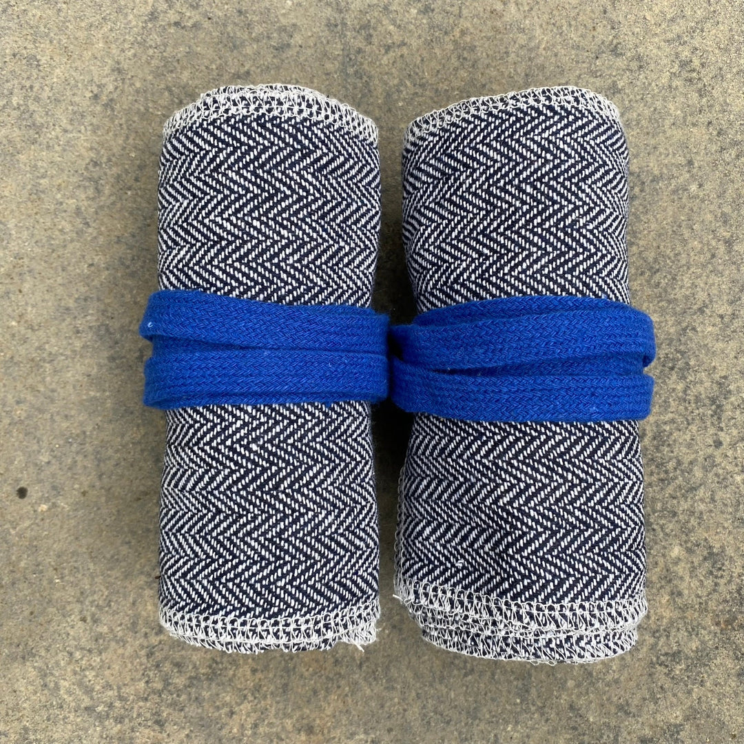 Set of Medieval LARPing Leg Wraps. They are Blue & White and made out of a Herringbone Wool mixture which are used to keep Trouser flares out of the way and legs warm. These Viking Wraps can wrap around your Legs to provide an extra flare to LARP kit