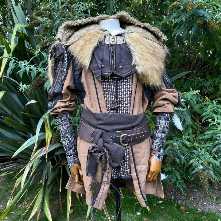 Set of Medieval LARPing Arm Wraps. They are coloured Brown & Black and made out of a Wool mixture which is used to keep sleeves out of the way and forearms warm. These Viking Arm Warps are 59 inches long, and can wrap around your arms to provide extra flare for your LARP costume, Ren Faire costume, or Cosplay.